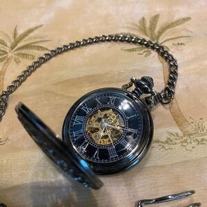 Intricate Silver Pocket Watch with Chain